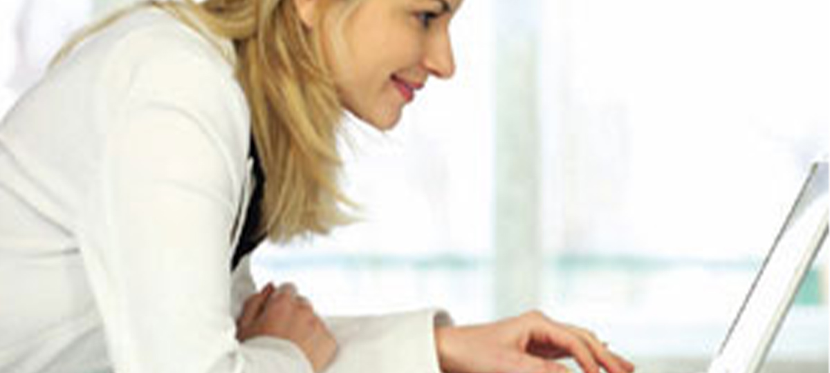 woman typing on laptop computer