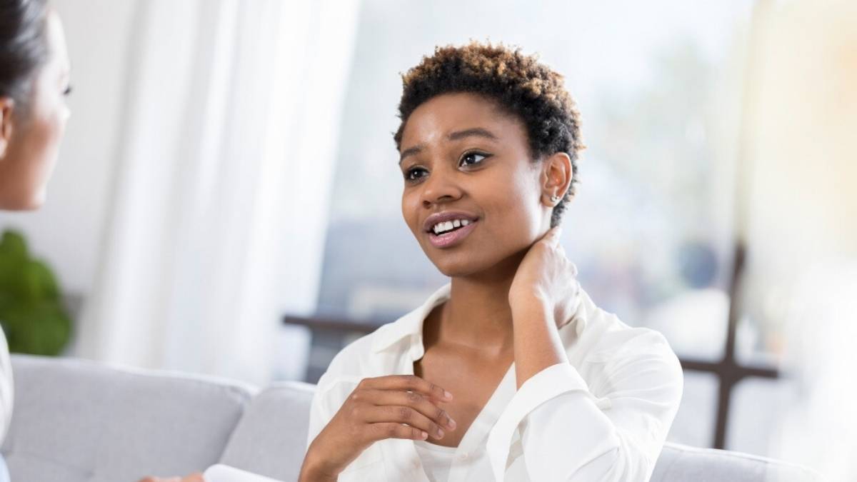 Woman talking with massage therapist