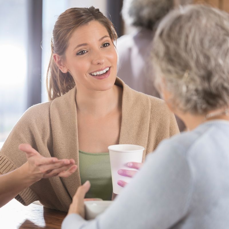 Two women socializing at restaurant table